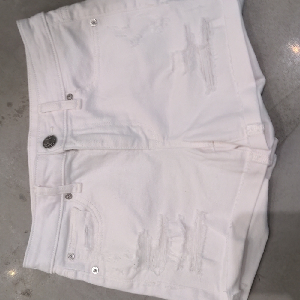 White distressed jean shorts